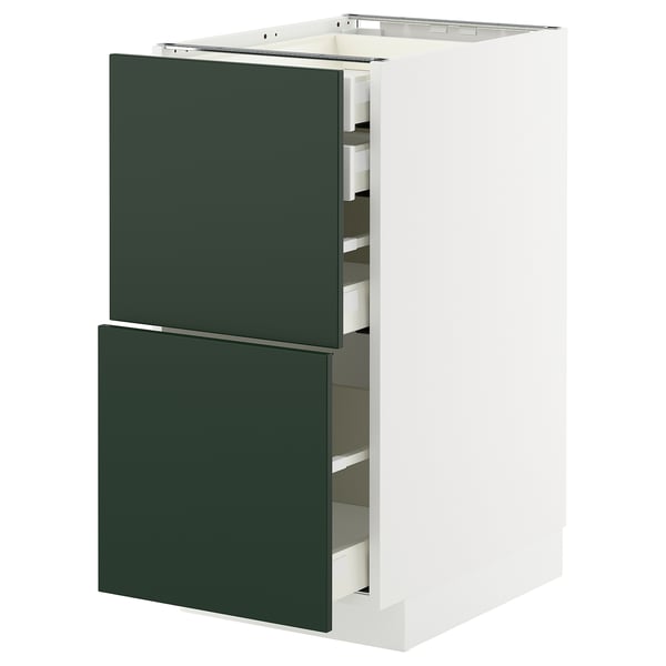 Modern kitchen unit with deep green drawers and white frame, sleek and minimalist design.