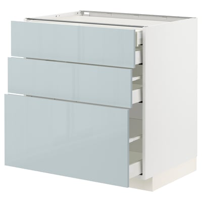 Ikea METOD white kitchen cabinet with 3 grey-blue drawers.