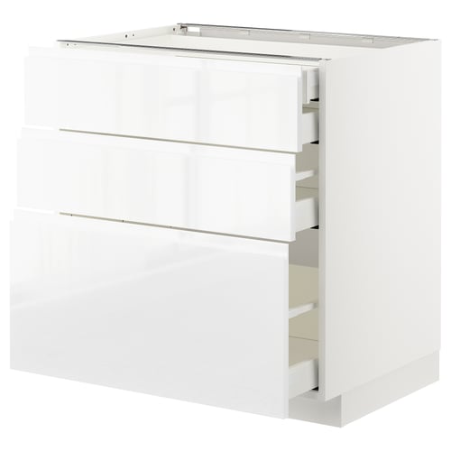 White high-gloss METOD kitchen cabinet with integrated handles and multiple drawers.