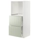 Depicts a METOD kitchen unit in green with a modern design, featuring adjustable shelves and smooth-running drawers.