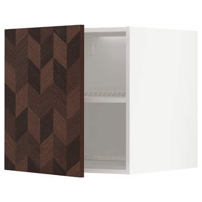 This image shows a white METOD kitchen cabinet with a dark wooden, herringbone-patterned door, featuring a single adjustable shelf inside.