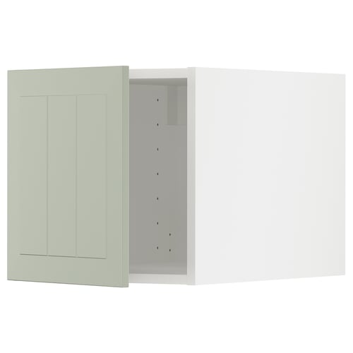 A green METOD kitchen cabinet with a panelled design and snap-on hinges.