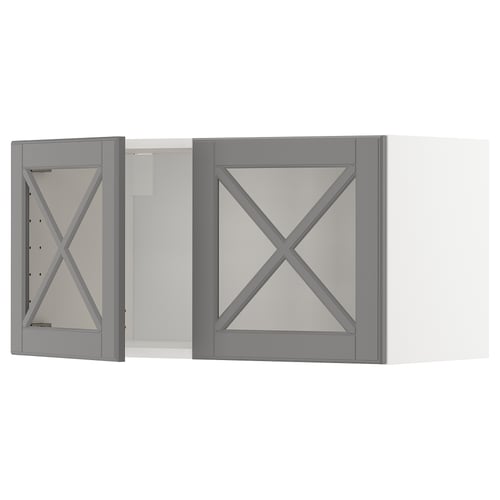 Two grey framed wall cabinets with bevelled glass doors, featuring an x-shaped design.