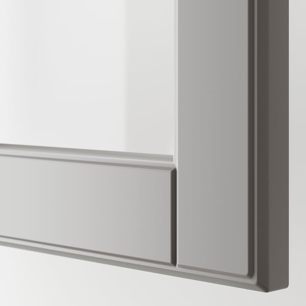 Close-up of modern glass cabinet door with sleek, grey finish and bevelled edges.