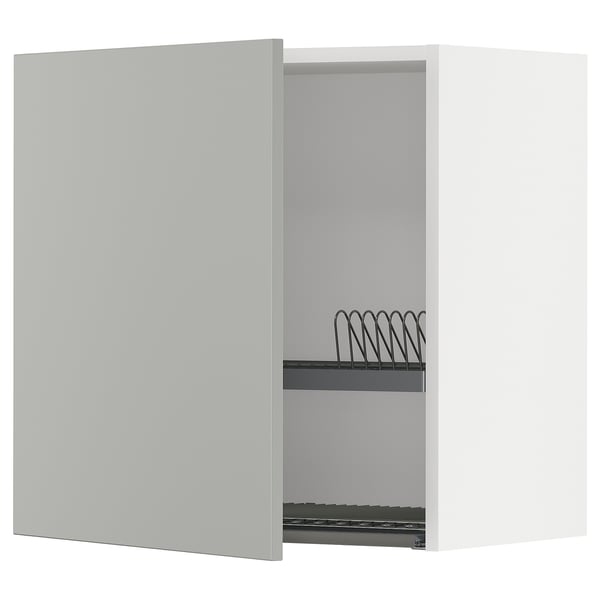 White kitchen cabinet with one door open showing metal wire rack, light grey, modern clean design.