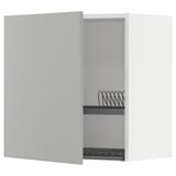 White kitchen cabinet with one door open showing metal wire rack, light grey, modern clean design.