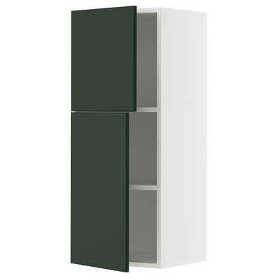 Image shows a white and green modern wall cabinet with adjustable shelves.
