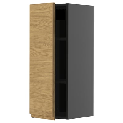 Modern kitchen cabinet with oak-wood door, black frame, rectangular shape, and minimalist design.