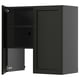 Black wall cabinet from METOD kitchen system, featuring two doors with beveled ash veneer edges. One door partially open, revealing shelf inside.