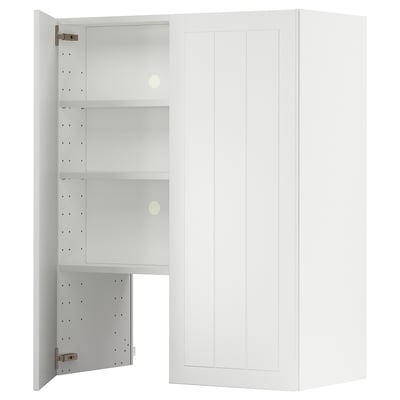 A white METOD kitchen cabinet with an open door, revealing adjustable shelves inside.