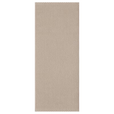 The MORUM rug in beige. Its rectangular, textured, and designed for both indoor and outdoor use. Durable polypropylene material.