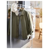 A MULIG green jacket on a white clothing rack with hooks and a hanging bag.
