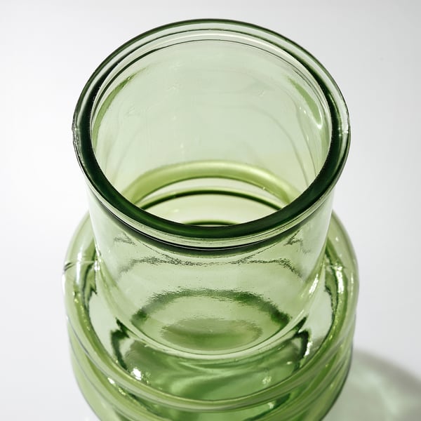 Green glass vase, recycled, textured surface.