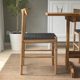 Wooden chair with woven seat; part of dining set.
