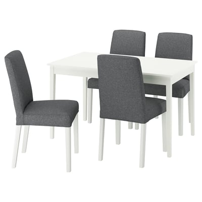A white extendable NÄSINGE dining set with four gray upholstered chairs.