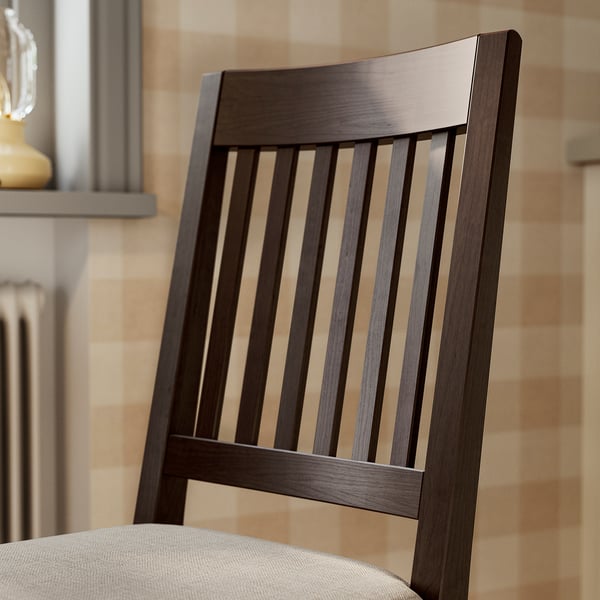 Dark wood chair with vertical slats and beige cushion. High-quality, sturdy design.
