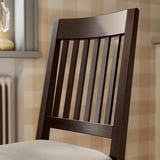 Dark wood chair with vertical slats and beige cushion. High-quality, sturdy design.