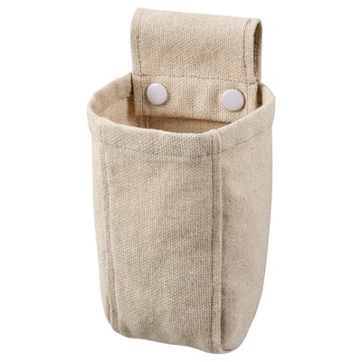 A NEREBY beige fabric organizer with pressed studs for mounting.