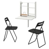 Image a white wall-mounted foldable table set with storage and two black folding chairs, perfect for small spaces.
