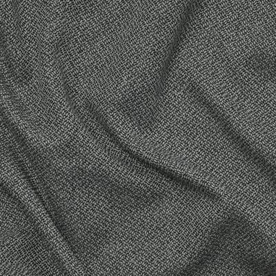 Soft, textured, grey melange fabric close-up, showcasing quality and detail.