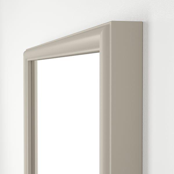 Modern beveled edge mirror, white frame, vertical orientation. Elegant, stylish design.