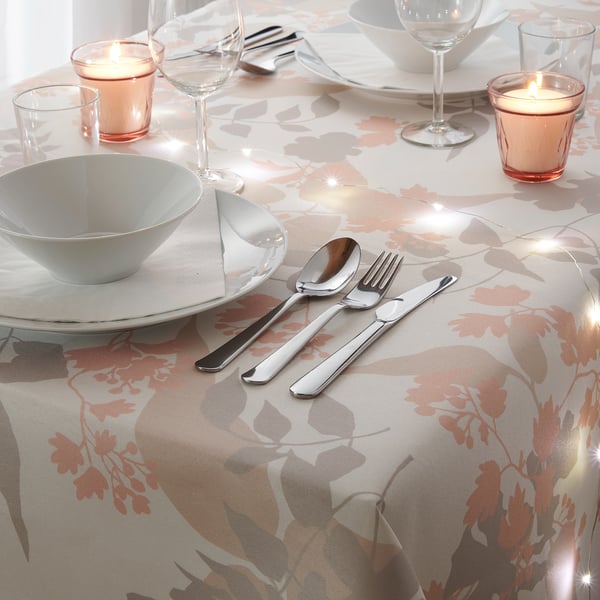 Elegant floral table setting with peach-brown OTYGLAD tablecloth, matching dining wear for 6-8, led candles.