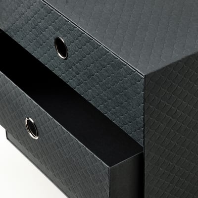 A PALLRA black organizer with three drawers, featuring a textured design and sleek metal handles.