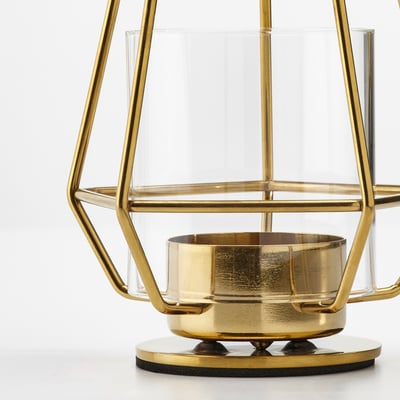 Modern golden lantern; clear glass; geometric design; eva base; stainless steel.