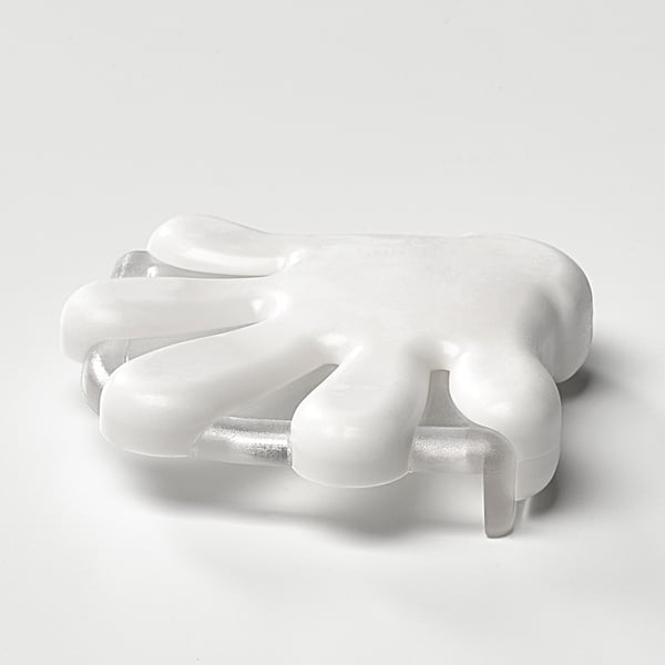 Transparent corner bumper with soft, curved edges on a white surface.