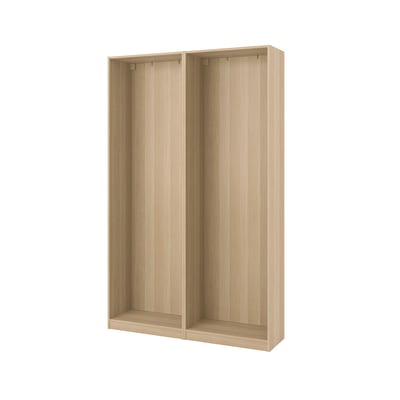 A light wooden PAX wardrobe frame. Its rectangular, simple, and sturdy, designed for organizing clothes and accessories.