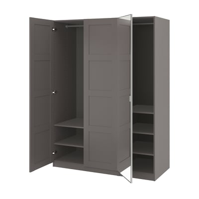 An open grey IKEA PAX wardrobe with multiple compartments and shelves.