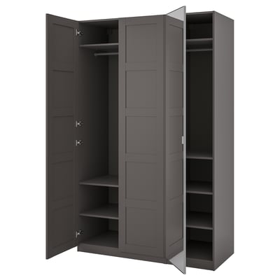 An open gray ikea PAX wardrobe with shelves and hangers inside.