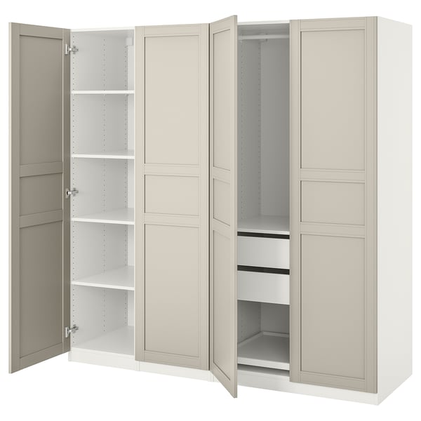 An open white PAX wardrobe with shelves and hanging space.