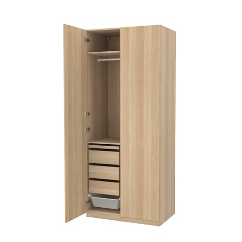 Open wooden PAX wardrobe with drawers and clothing rod.