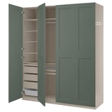 A green ikea PAX wardrobe with open doors, revealing shelves and storage inside.