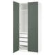 An open PAX wardrobe in white with green doors, featuring shelves and a mesh basket.
