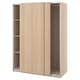 Light pine ikea PAX wardrobe with sliding doors and shelves.