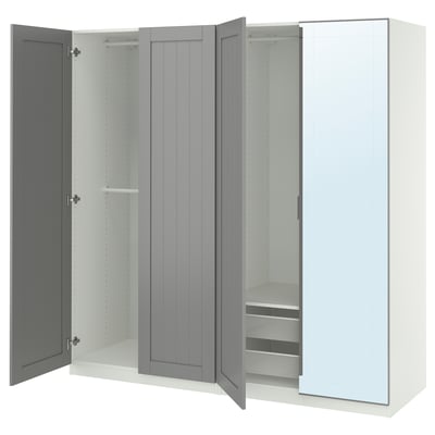 An open gray and white PAX wardrobe with glass and wooden doors, featuring shelves and drawers inside.