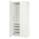 White PAX wardrobe, floral design, open door revealing shelves and mesh baskets.