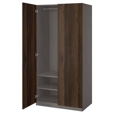 A dark brown PAX wardrobe with two open doors revealing shelves and a hanging rod inside.