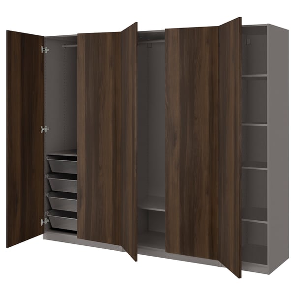 A PAX wardrobe with wooden doors open, revealing shelves and drawers inside. Its brown and offers ample storage.