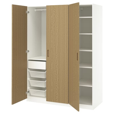PAX wardrobe with oak doors and white interior, open to show shelves and drawers.