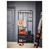 Metal shoe rack with bench and hooks for coats, bags, and hats.