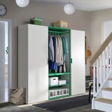 Modern PLATSA wardrobe in green and white under stairs with storage boxes and adjustable feet.