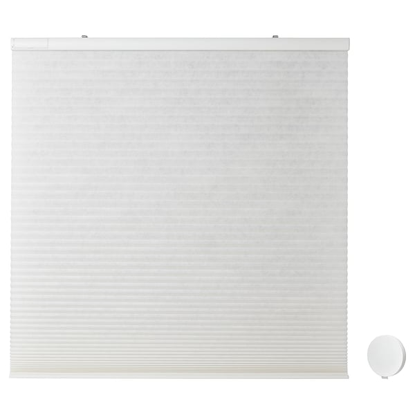 White PRAKTLYSING cellular blind, cordless, remote-controlled window treatment.