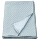 Option: Folded light blue recycled polyester/cotton quilted bedspread with diamond pattern.
