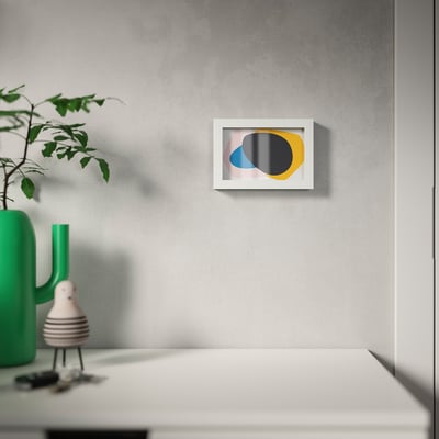 A white RÖDALM picture frame, rectangular and modern, with a removable front protection panel.