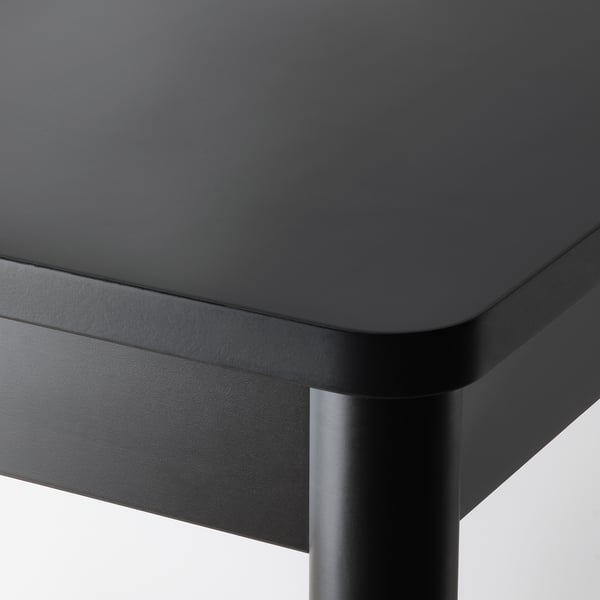 Close-up of smooth, high-quality tabletop with rounded edges and glossy finish. Shows fine wood grain and sturdy construction.