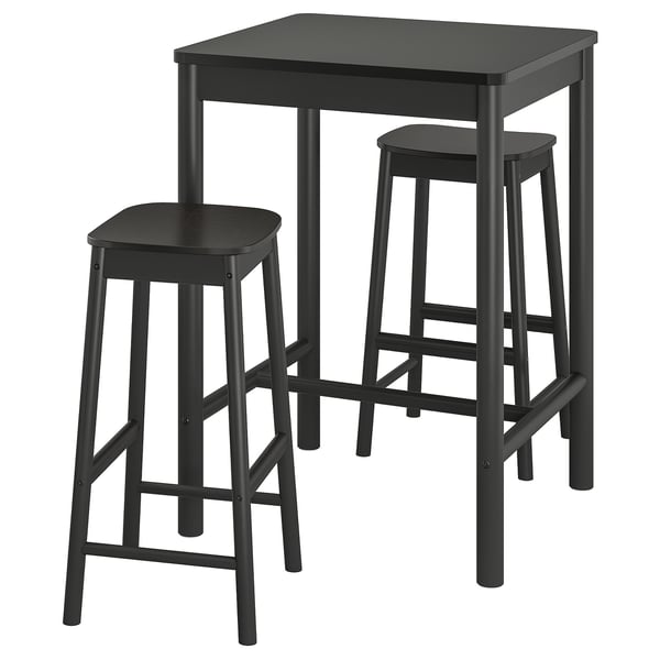 A RÖNNINGE black bar set with a square table and two matching stools, made of wood with metal accents.