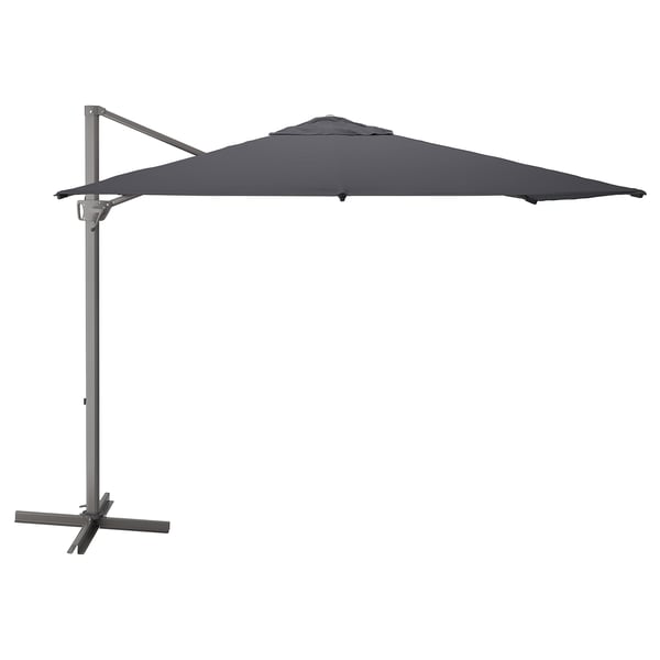 A gray SEGLARÖ parasol with a square shape and a metal stand. It a fabric canopy and a wind vent.